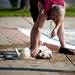 Ron Geis of Ypsilanti plays with his 18-week-old golden retriever puppy Lark during Dog Swim 2012 at Buhr Park Pool in Ann Arbor on Thursday evening. Joseph Tobianski | AnnArbor.com